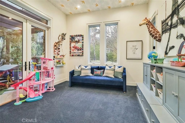 playroom with french doors and dark colored carpet