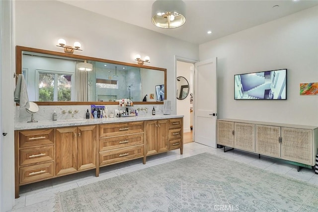 bathroom featuring tile patterned flooring, decorative backsplash, walk in shower, and vanity