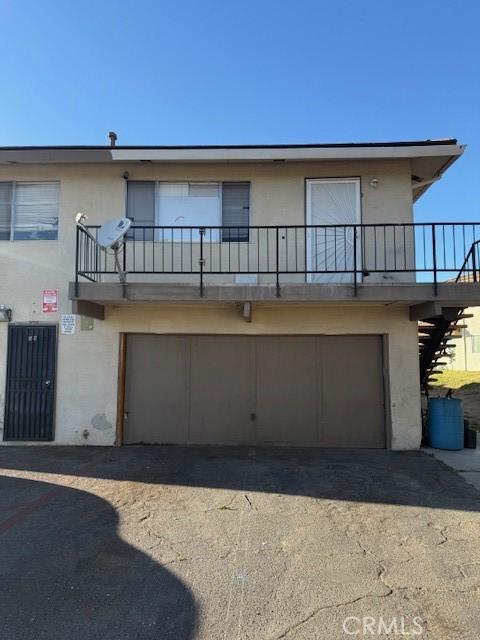 back of house featuring a garage