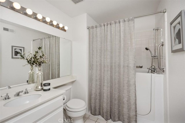 bathroom with tile patterned flooring, vanity, a shower with curtain, and toilet