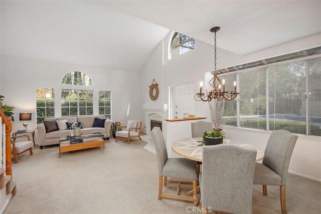 carpeted dining area with vaulted ceiling and a notable chandelier