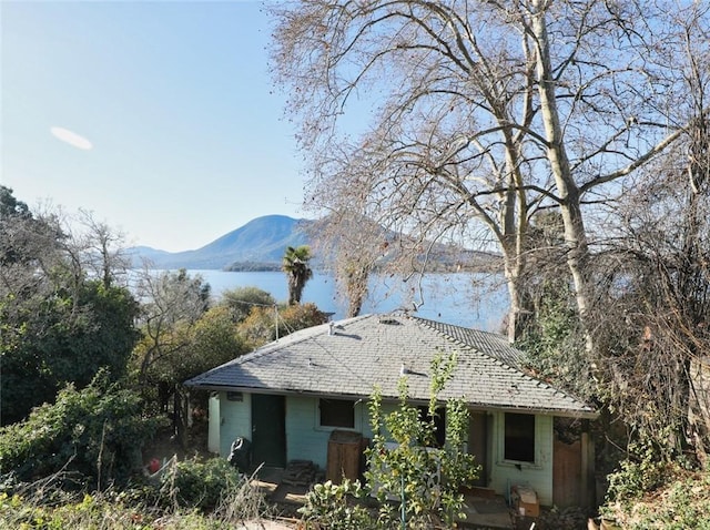 exterior space featuring a water and mountain view