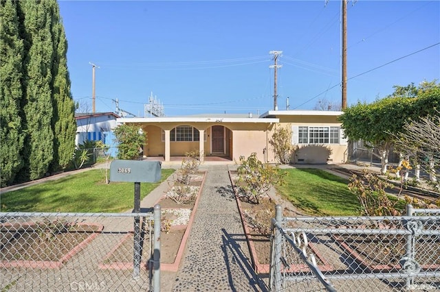 ranch-style home featuring a front lawn