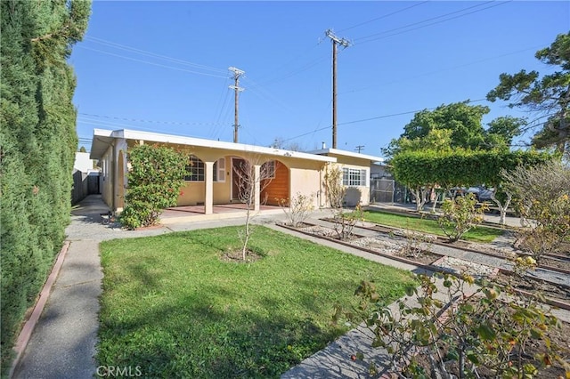 view of front of property with a front lawn