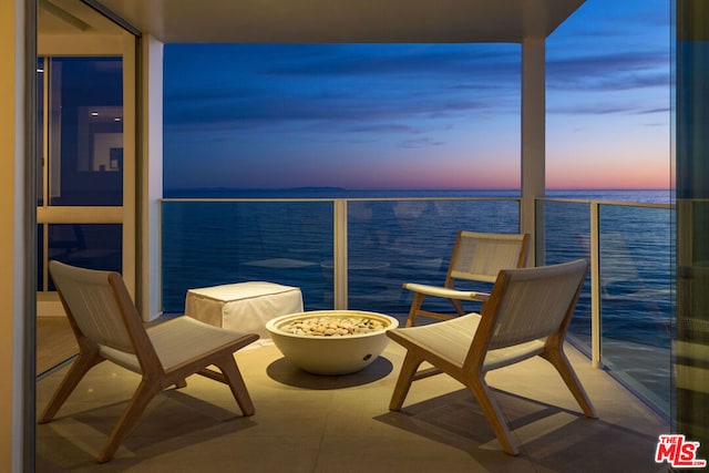 balcony at dusk with a water view