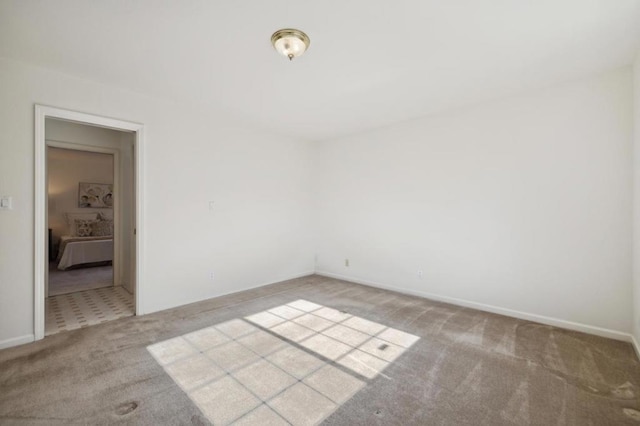 empty room featuring light carpet