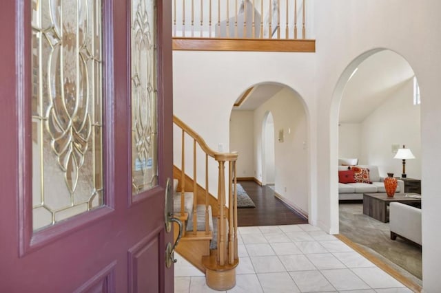 foyer entrance with light tile patterned flooring