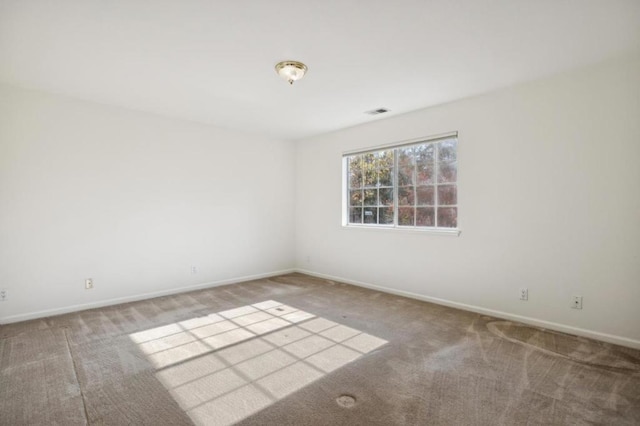 empty room with carpet flooring