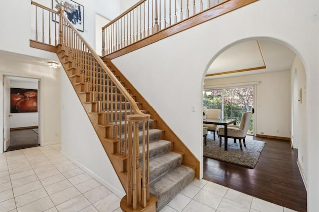 stairway with tile patterned floors