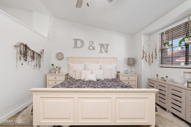 bedroom featuring ceiling fan and lofted ceiling