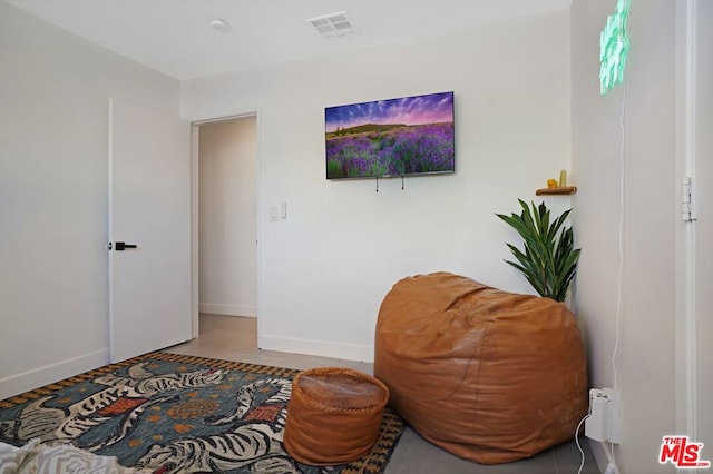 living area featuring tile patterned flooring