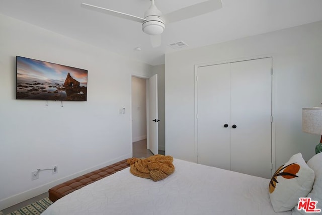 bedroom featuring ceiling fan and a closet