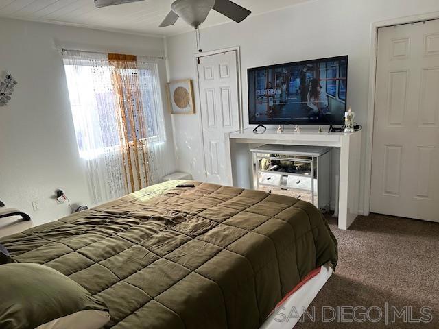 carpeted bedroom with ceiling fan