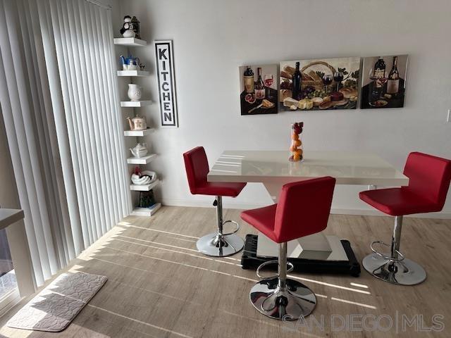 dining space with light hardwood / wood-style floors