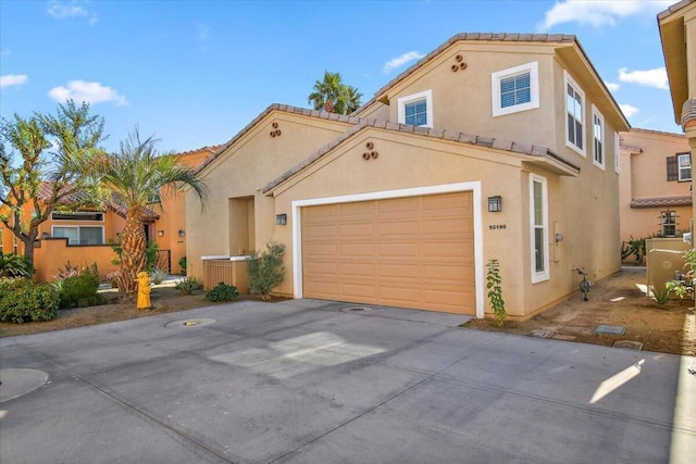 mediterranean / spanish-style home featuring a garage