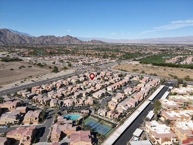 birds eye view of property with a mountain view