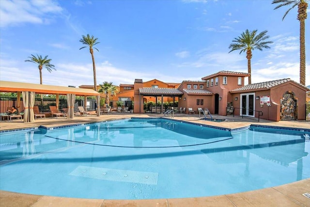 view of pool featuring a patio