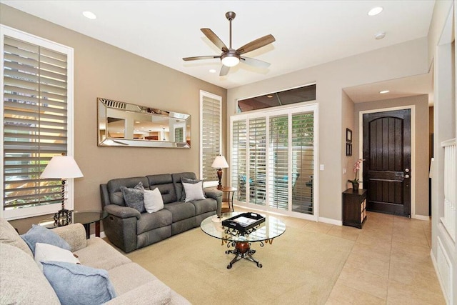 living room with ceiling fan and light tile patterned floors