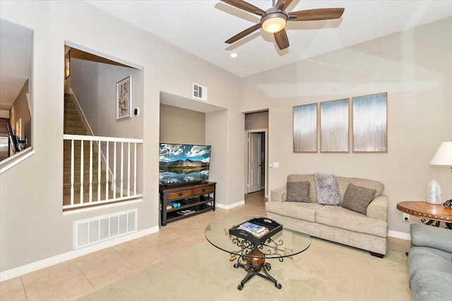 tiled living room with ceiling fan