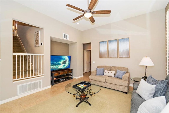 living room with ceiling fan and tile patterned flooring