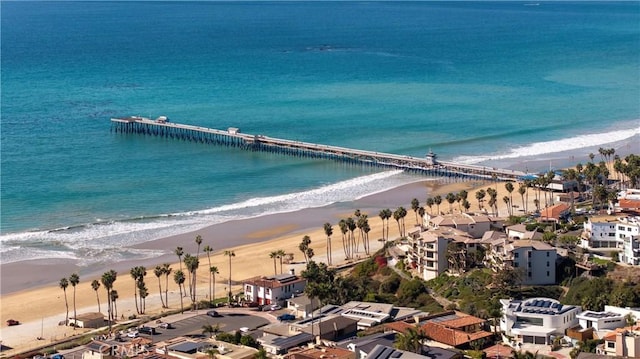 bird's eye view with a water view and a view of the beach