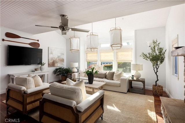 living room featuring ceiling fan and hardwood / wood-style floors