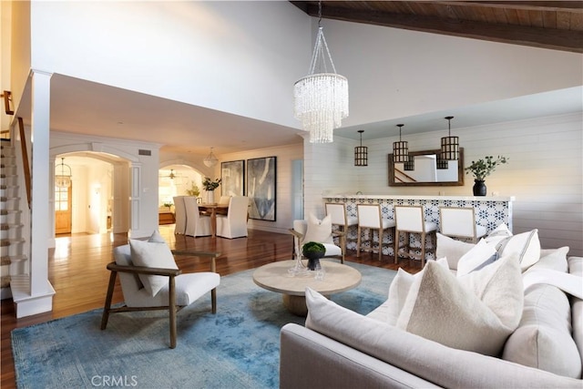 living room with wooden ceiling, a chandelier, hardwood / wood-style flooring, and beamed ceiling