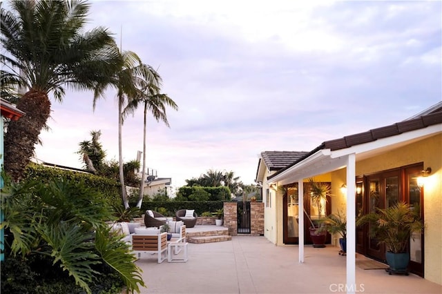 view of patio terrace at dusk