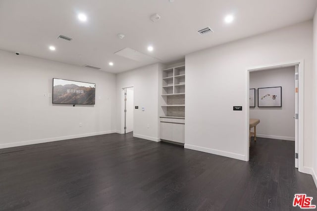 interior space with dark hardwood / wood-style floors