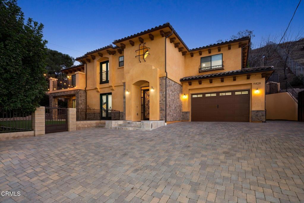 mediterranean / spanish house featuring a garage