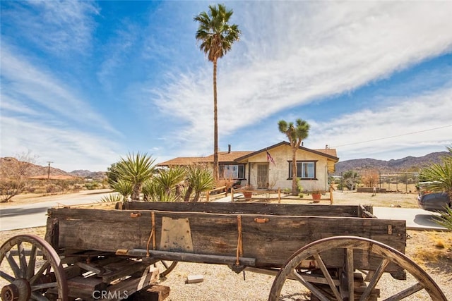 view of front of property with a mountain view