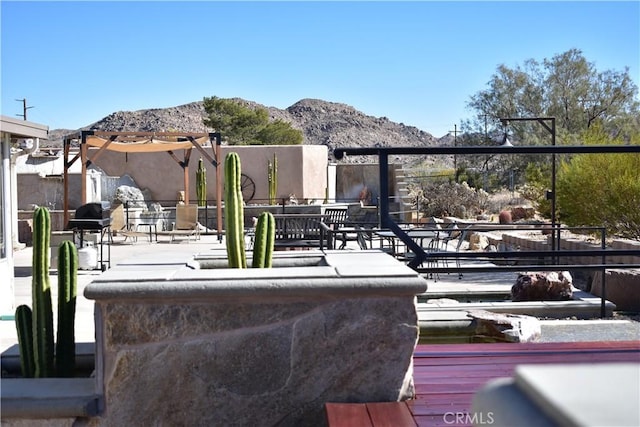 view of patio / terrace with a mountain view