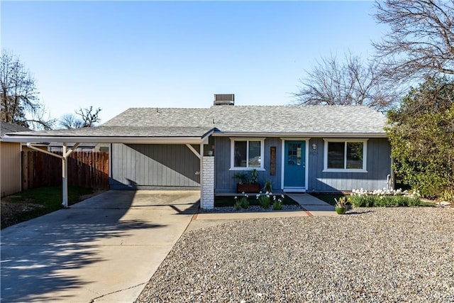 ranch-style home with a carport