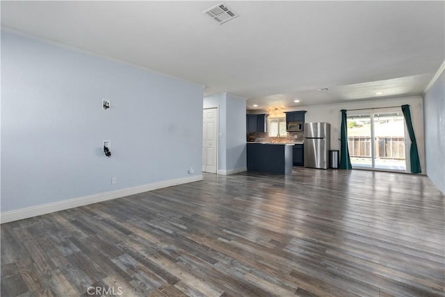 unfurnished living room with dark wood-type flooring