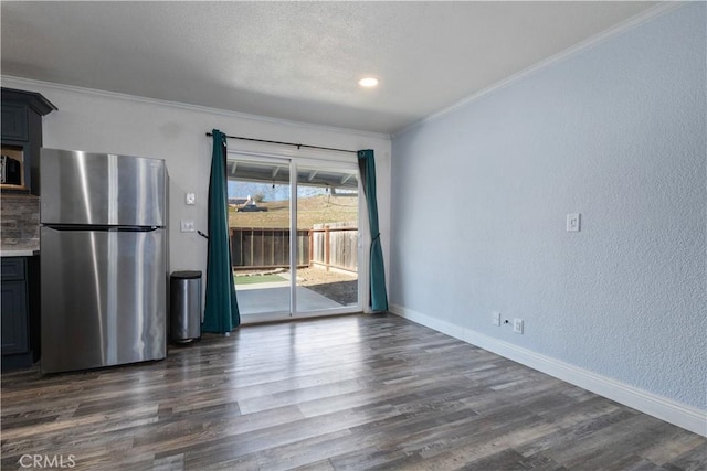 interior space with dark wood-type flooring and ornamental molding