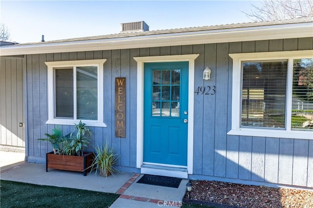 doorway to property featuring cooling unit