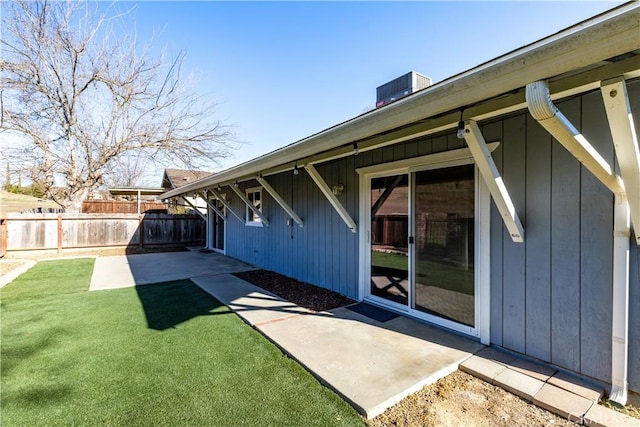 exterior space with a patio, a yard, and central AC unit