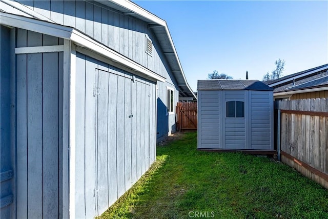 view of outbuilding featuring a yard