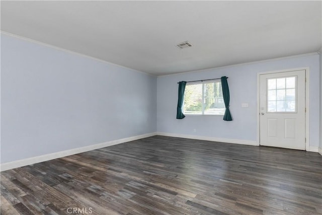 interior space featuring crown molding and dark hardwood / wood-style flooring