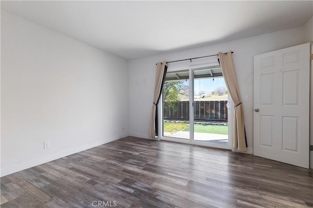 empty room featuring dark wood-type flooring