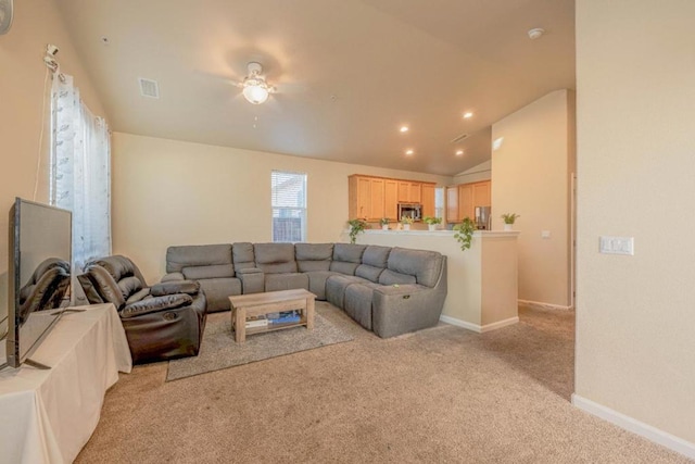 living room with light carpet, vaulted ceiling, and ceiling fan