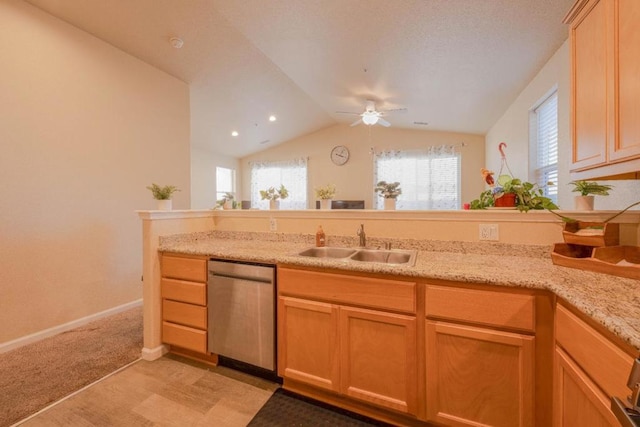 kitchen with vaulted ceiling, sink, stainless steel dishwasher, light colored carpet, and ceiling fan