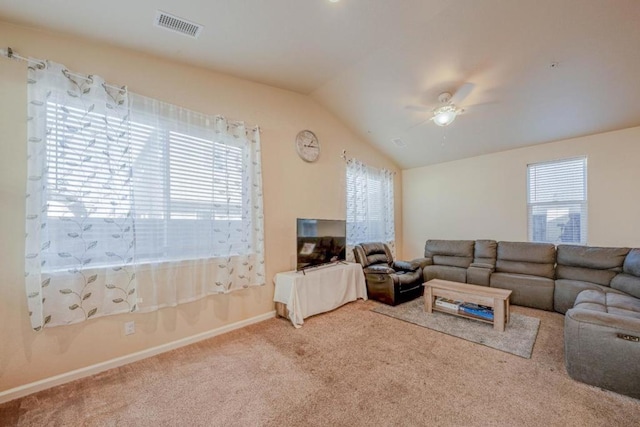 carpeted living room with lofted ceiling and ceiling fan