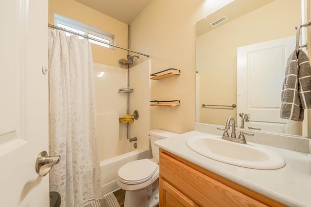 full bathroom with vanity, toilet, and shower / bath combo with shower curtain