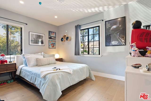 bedroom featuring light wood-type flooring