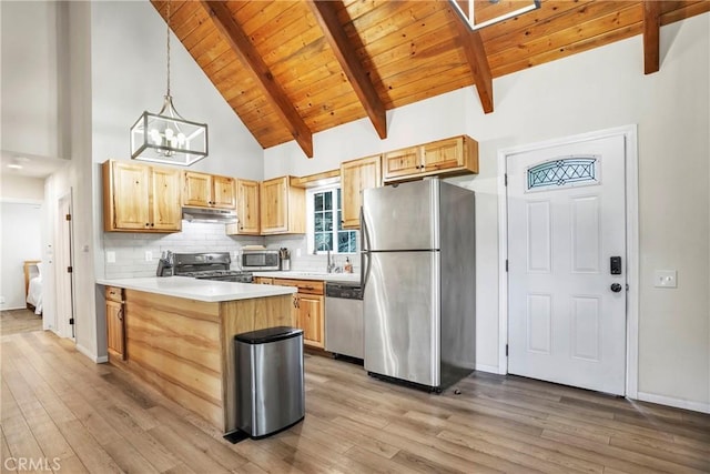 kitchen with pendant lighting, appliances with stainless steel finishes, light brown cabinetry, high vaulted ceiling, and beam ceiling