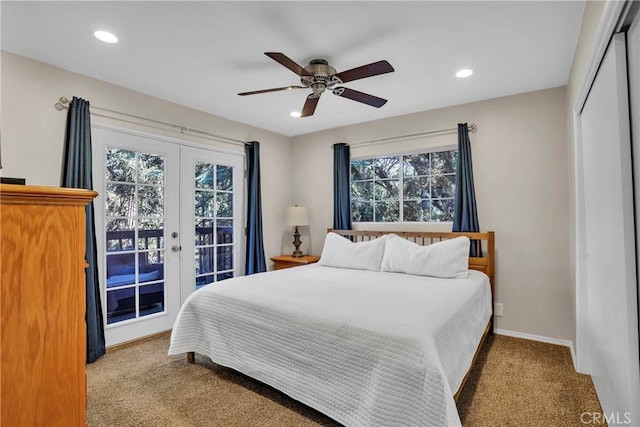 bedroom with ceiling fan, a closet, access to outside, light carpet, and french doors