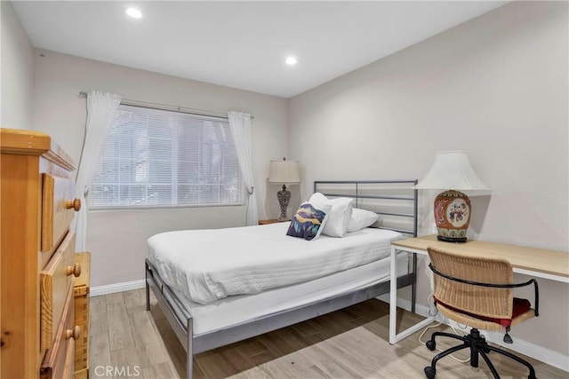 bedroom featuring light hardwood / wood-style floors