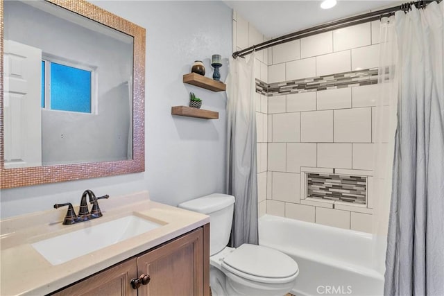 full bathroom featuring toilet, vanity, and shower / bathtub combination with curtain