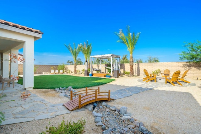 view of patio with a fire pit and a pergola